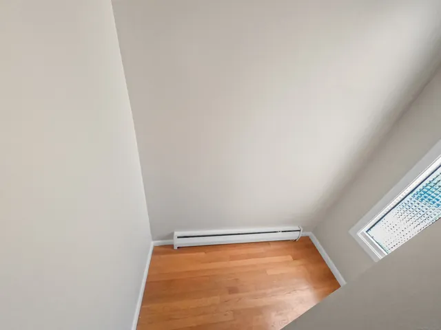 a view of a bathroom with bathtub