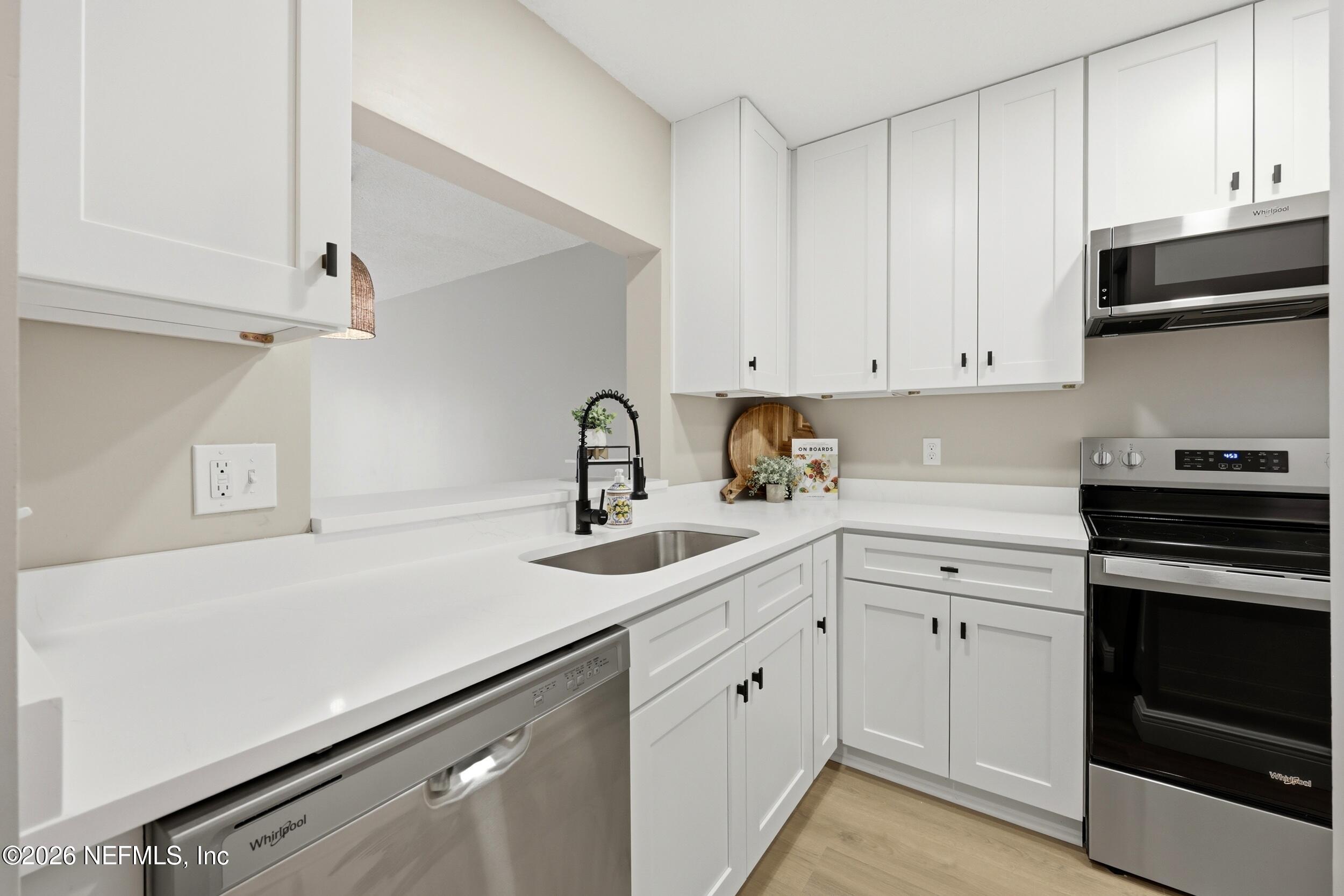 3801 Crown Point Road, Unit 2093 Jacksonville, FL 32257 - Photo 2 of 29 White Kitchen cabinets