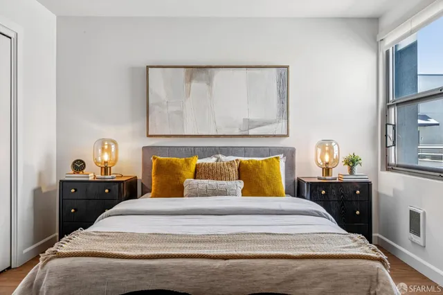 a bedroom with a bed and a dresser