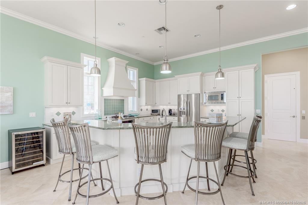 5032 Watersong Way Fort Pierce, FL 34949 - Photo 27 of 55 a view of a dining room with furniture