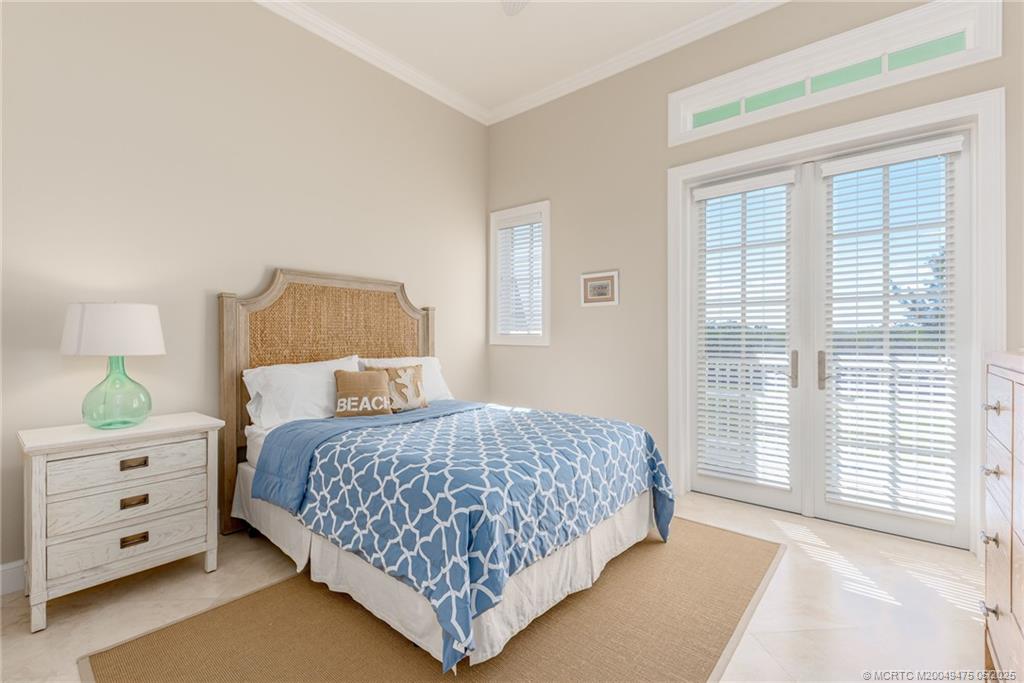 5032 Watersong Way Fort Pierce, FL 34949 - Photo 34 of 55 a bedroom with a large bed and a window