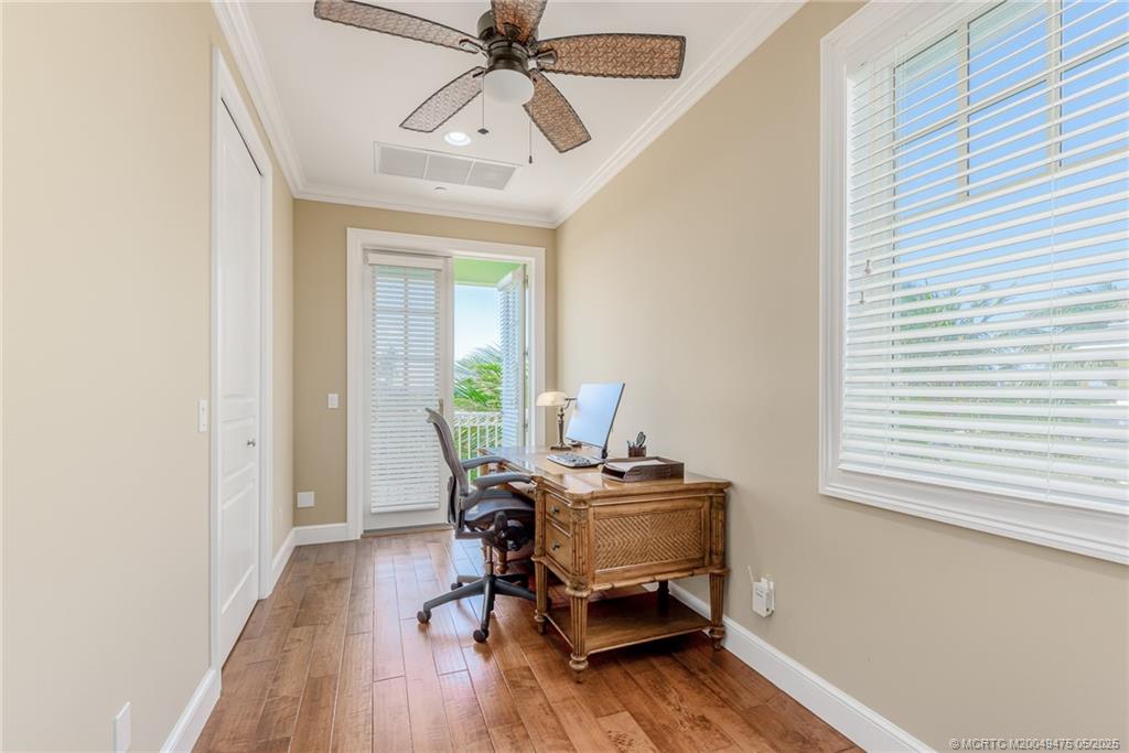 5032 Watersong Way Fort Pierce, FL 34949 - Photo 39 of 55 a workspace with wooden floor and a window
