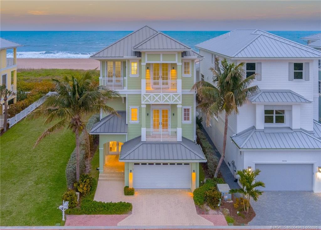 5032 Watersong Way Fort Pierce, FL 34949 - Photo 4 of 55 a front view of a house with a yard