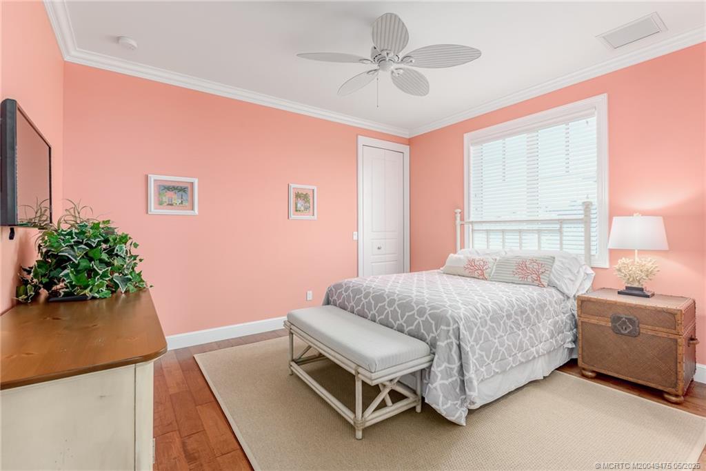 5032 Watersong Way Fort Pierce, FL 34949 - Photo 48 of 55 a bedroom with a bed and a potted plant