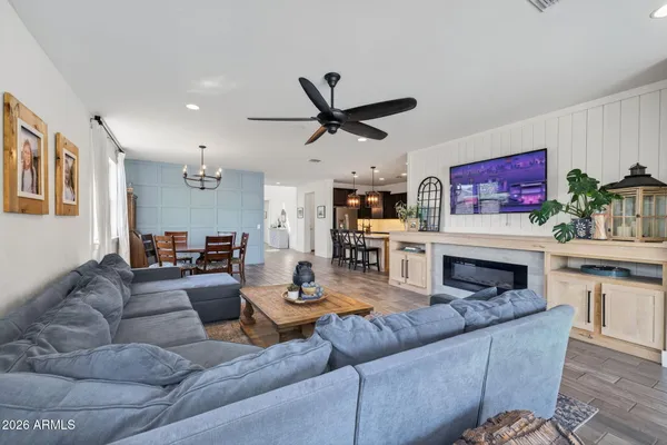 a kitchen with granite countertop cabinets stove and microwave