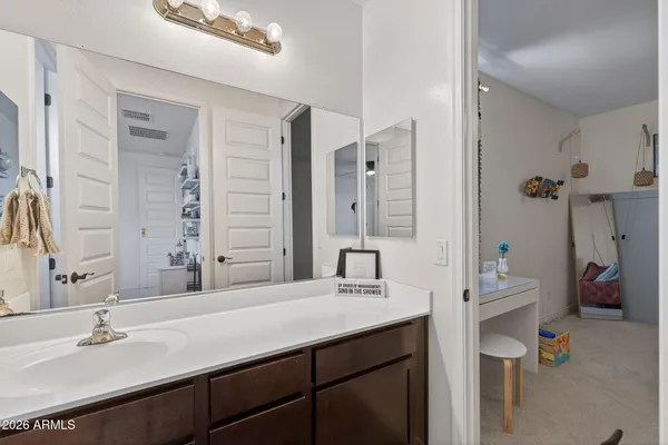 a view of a swimming pool with outdoor seating