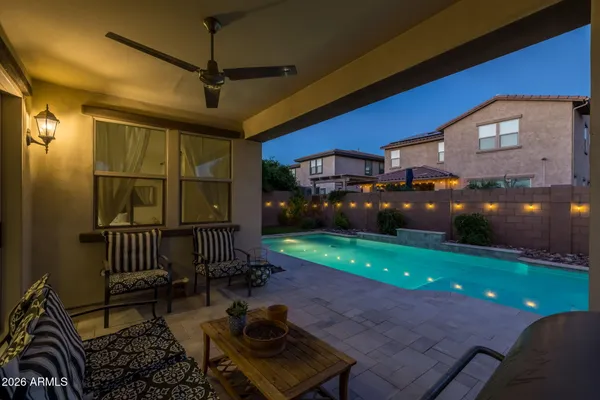 a view of a patio with a table and chairs