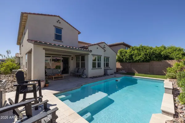 a view of a swimming pool with a patio