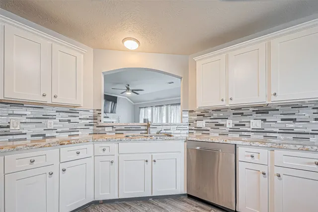 a kitchen with appliances cabinets and a sink