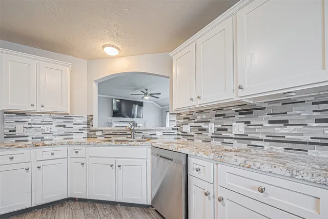 a kitchen with appliances cabinets and a sink
