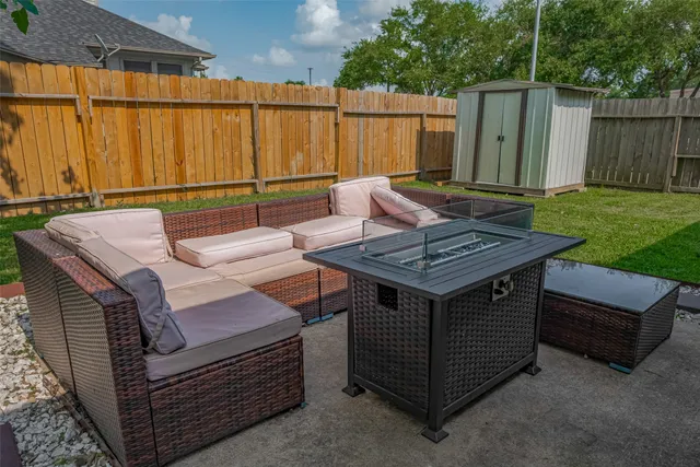 a view of a backyard with a sink and a couch