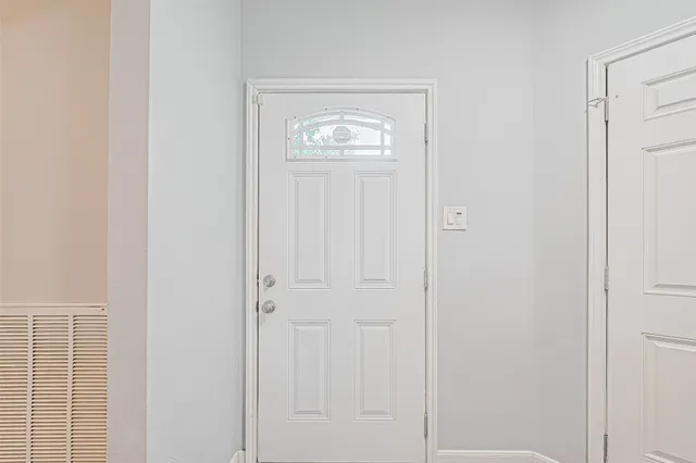 a view of an entryway with hallway