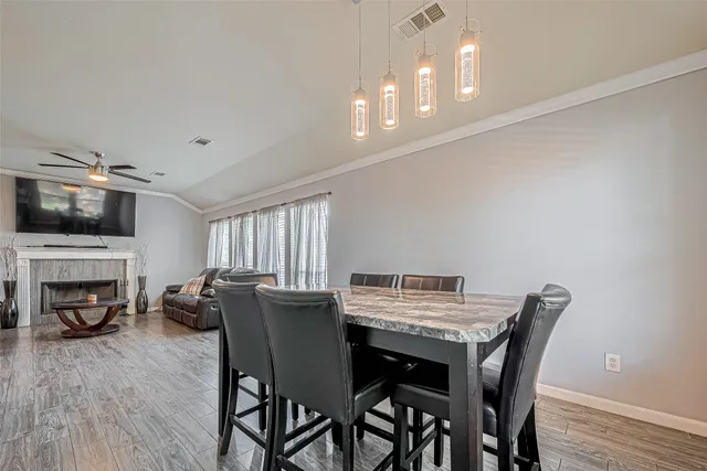 a view of a dining room with furniture window and wooden floor