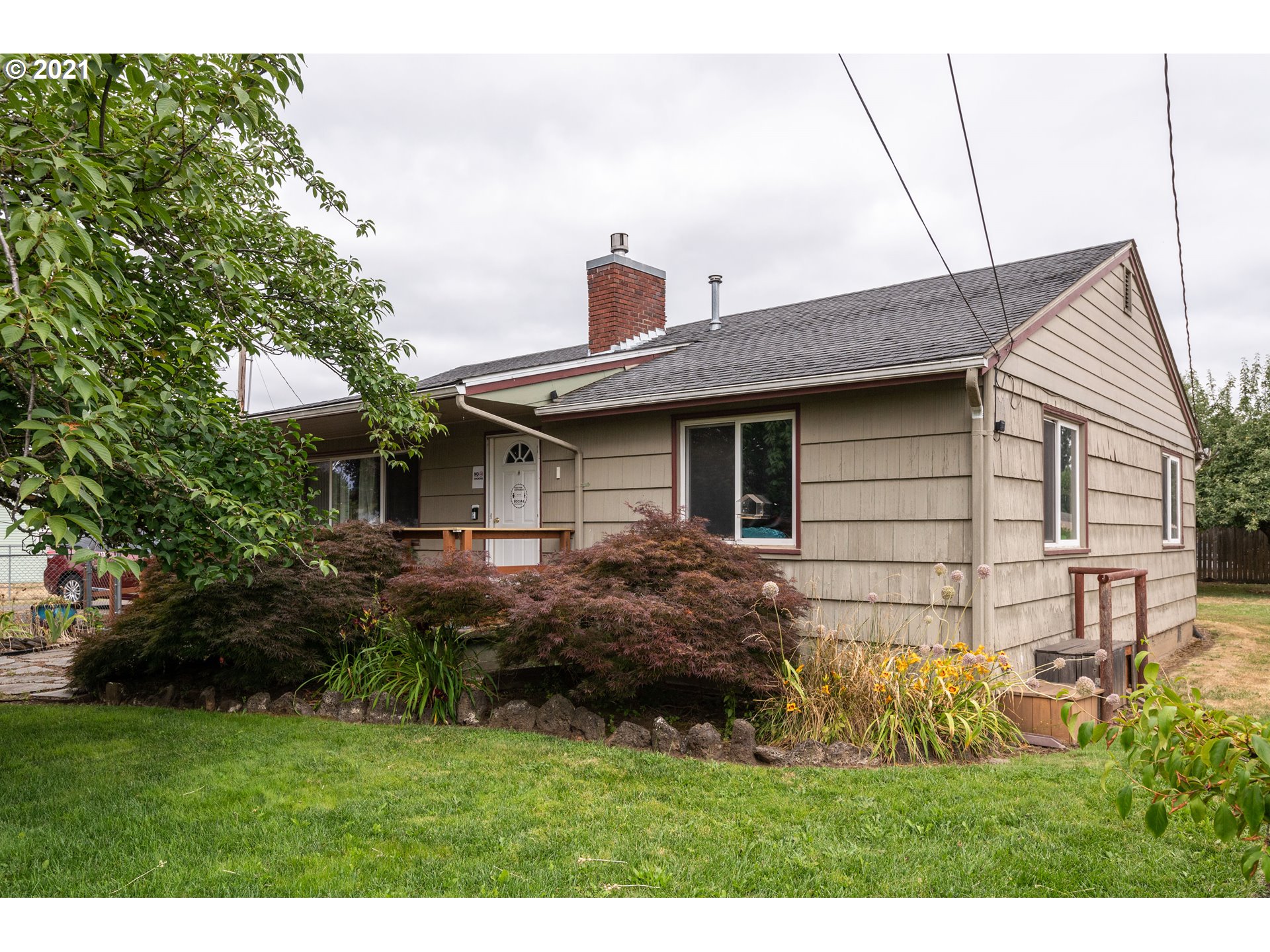 4954 E Street Springfield, OR 97478 - Photo 2 of 23 a view of a house with a yard
