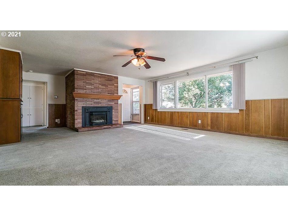 4954 E Street Springfield, OR 97478 - Photo 12 of 23 a open kitchen with furniture and a fireplace