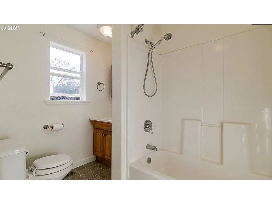 4954 E Street Springfield, OR 97478 - Photo 15 of 23 a bathroom with a sink a toilet and shower