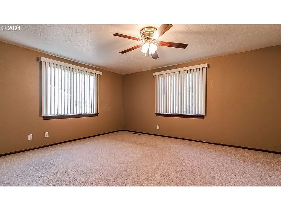 4954 E Street Springfield, OR 97478 - Photo 17 of 23 a room with windows and ceiling fan