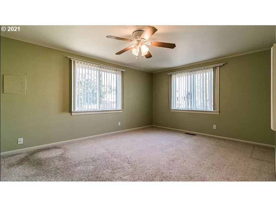 4954 E Street Springfield, OR 97478 - Photo 19 of 23 a room with windows and chandelier fan