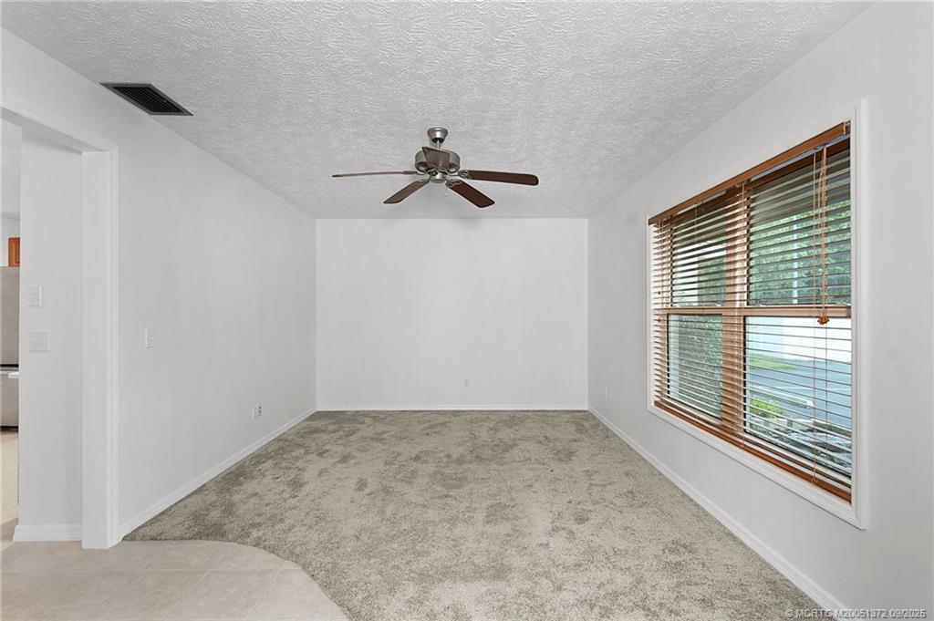 50 Southwest Blackburn Terrace, Unit 8 Stuart, FL 34997 - Photo 18 of 42 a view of room with a ceiling fan