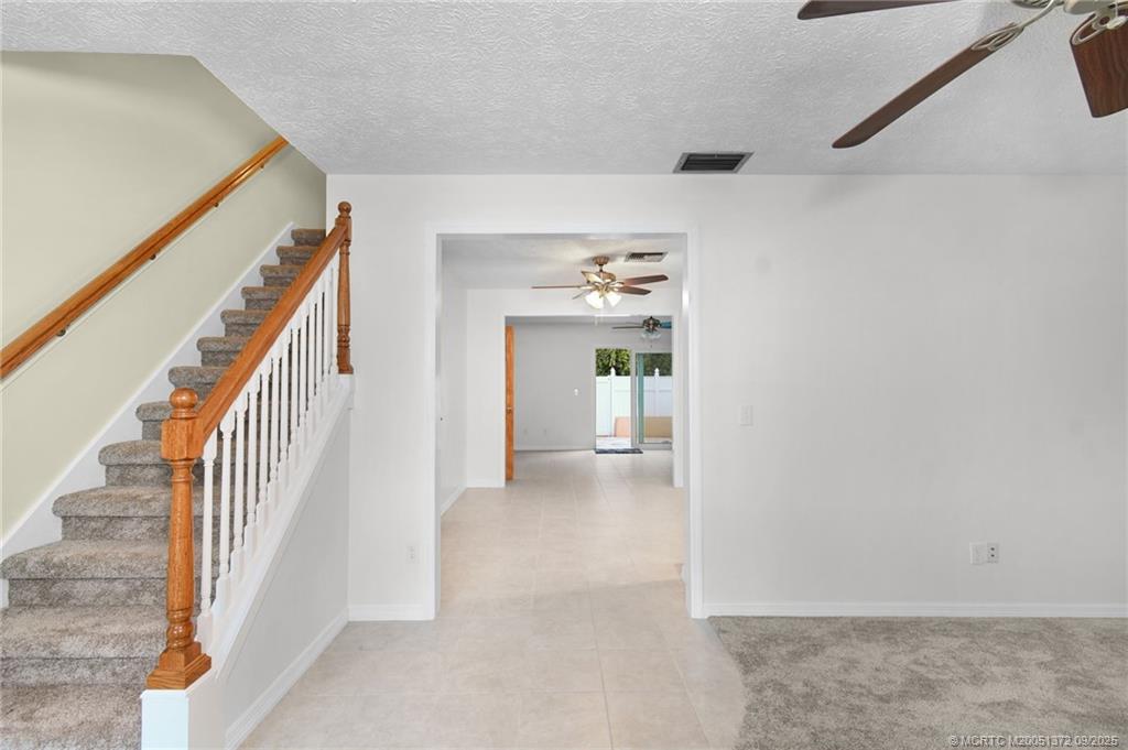 50 Southwest Blackburn Terrace, Unit 8 Stuart, FL 34997 - Photo 20 of 42 a view of a hallway with wooden floor and entryway