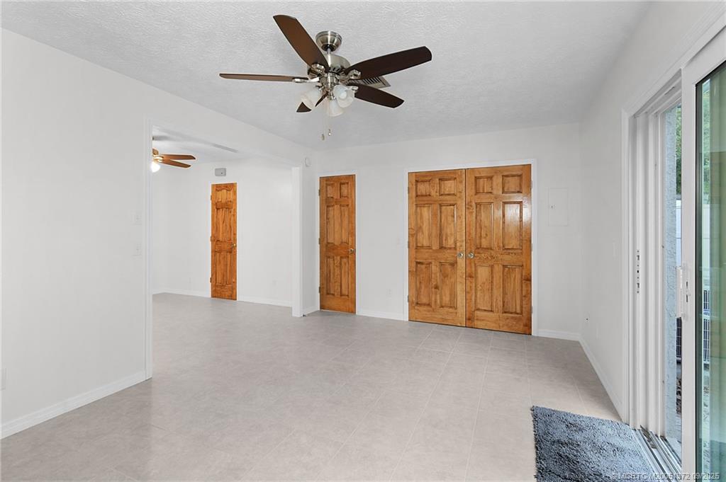 50 Southwest Blackburn Terrace, Unit 8 Stuart, FL 34997 - Photo 27 of 42 a view of an empty room with a window