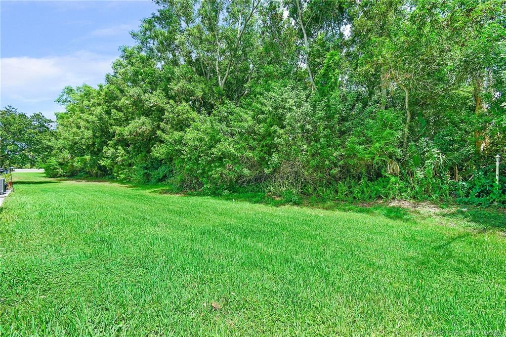 50 Southwest Blackburn Terrace, Unit 8 Stuart, FL 34997 - Photo 34 of 42 a view of yard with green space