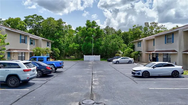 a view of a cars parked in front of a house