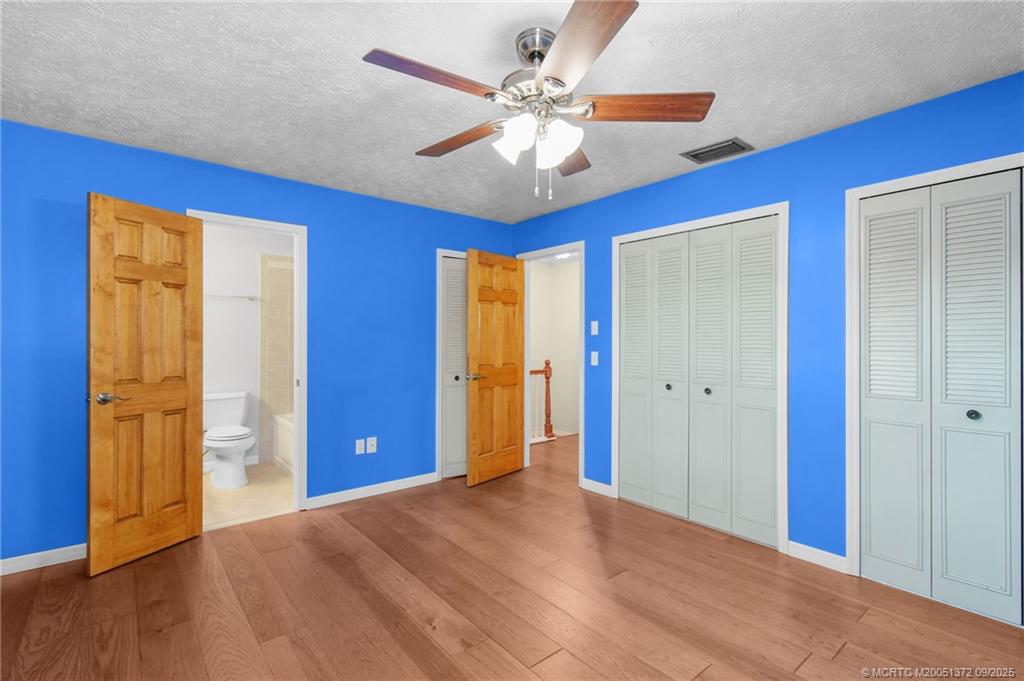 50 Southwest Blackburn Terrace, Unit 8 Stuart, FL 34997 - Photo 7 of 42 a view of an empty room with window and wooden floor
