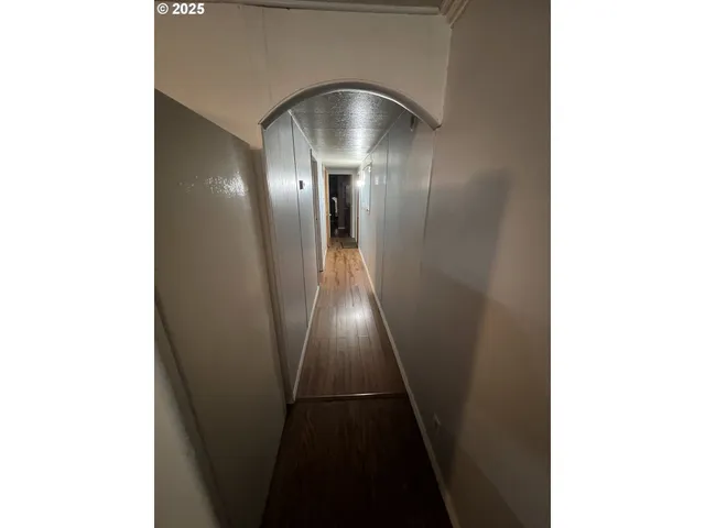 a bedroom with a bed and a mirror