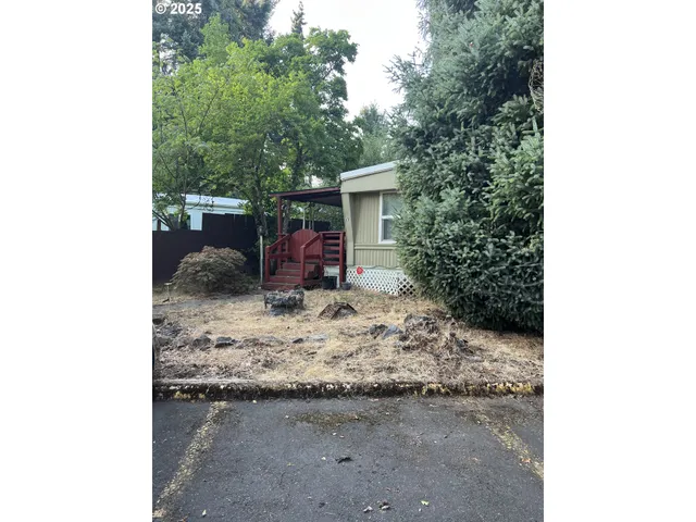 a view of a backyard of the house