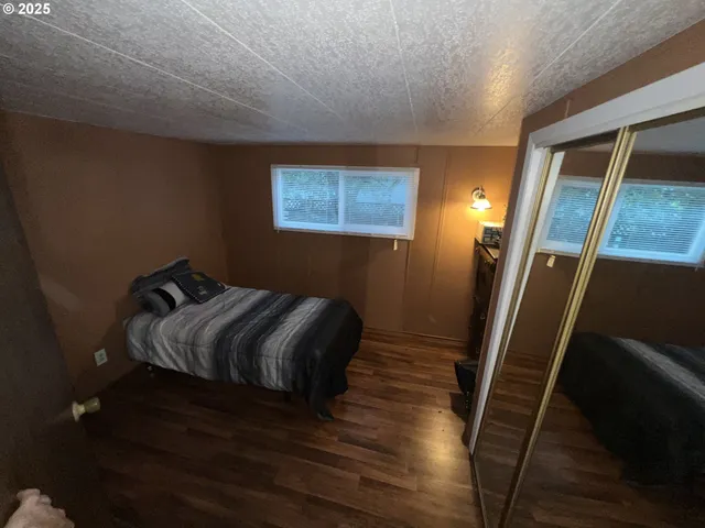a view of a living room with wooden floor