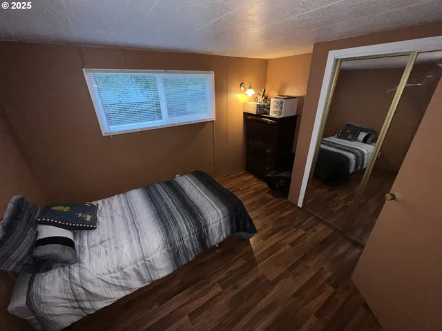 a view of living room with furniture and a fireplace