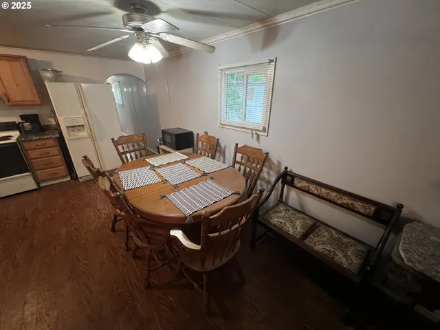 a kitchen with stainless steel appliances granite countertop a refrigerator stove and sink