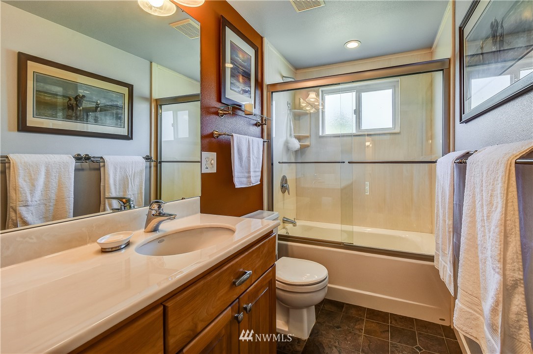 417 212th Street Southwest Bothell, WA 98021 - Photo 13 of 28 a bathroom with a sink a toilet and shower