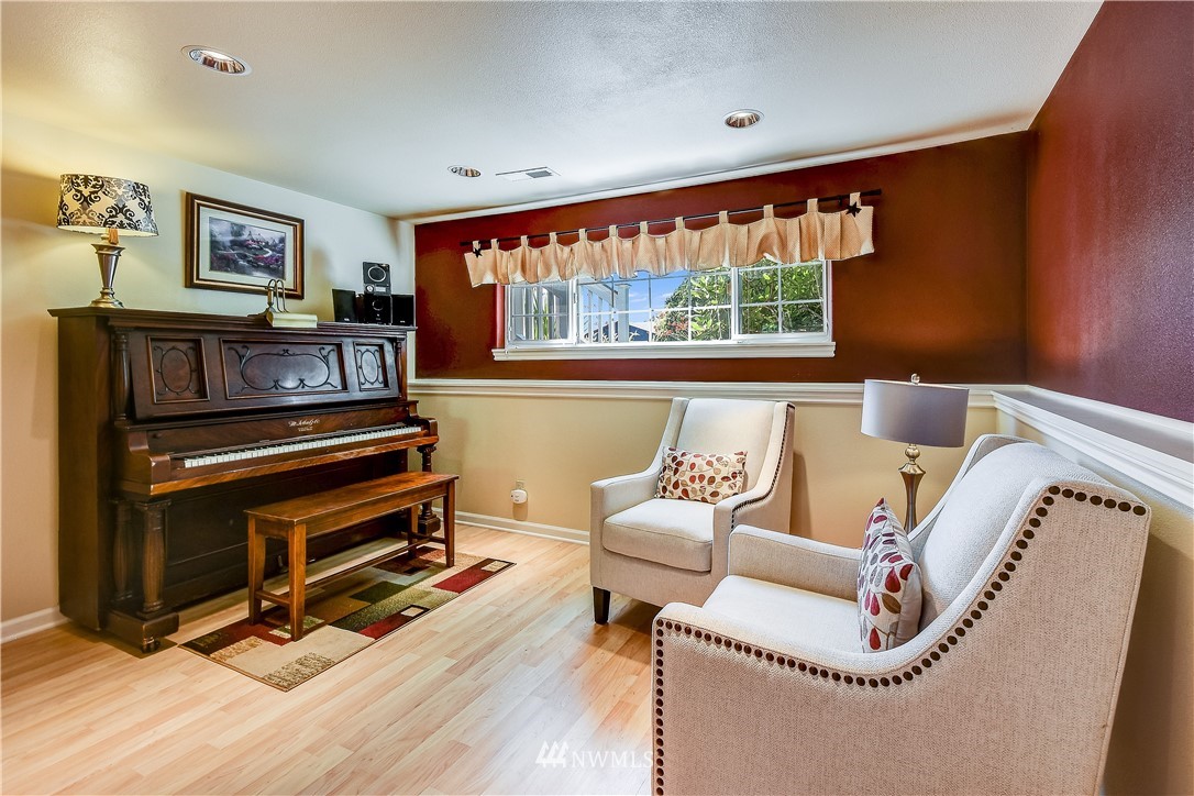 417 212th Street Southwest Bothell, WA 98021 - Photo 18 of 28 a living room with furniture and a floor to ceiling window