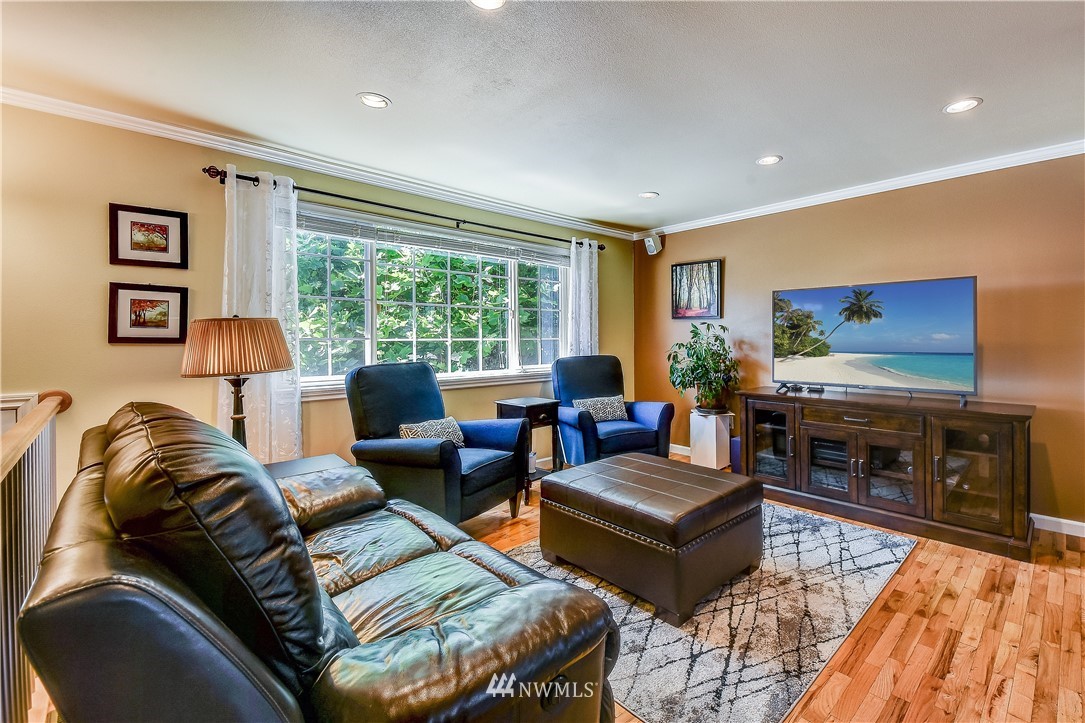 417 212th Street Southwest Bothell, WA 98021 - Photo 3 of 28 a living room with furniture and a fireplace