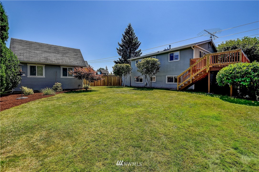 417 212th Street Southwest Bothell, WA 98021 - Photo 24 of 28 a view of a house with a yard and sitting area