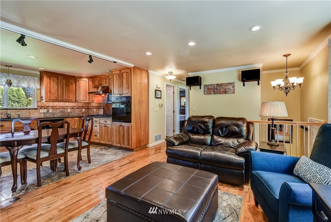 417 212th Street Southwest Bothell, WA 98021 - Photo 5 of 28 a living room with furniture and a wooden floor