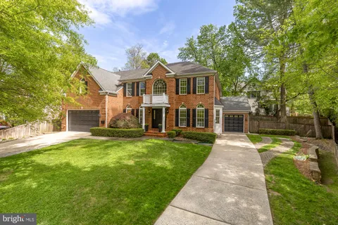 a front view of a house with yard