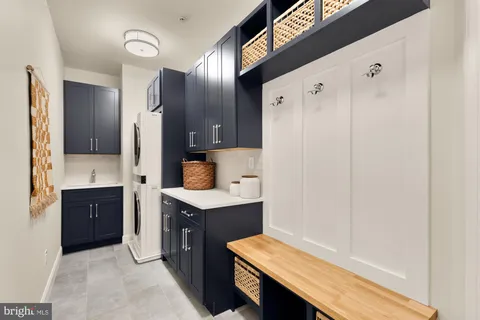 a spacious bathroom with a granite countertop sink mirror and shower