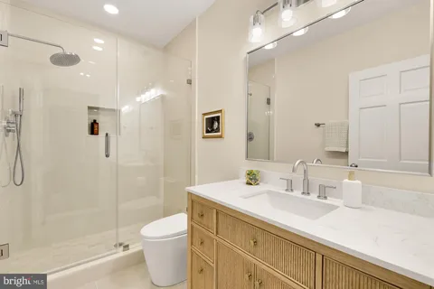 a bathroom with a toilet sink and shower
