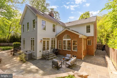 a view of a house with lounge chair in front of house