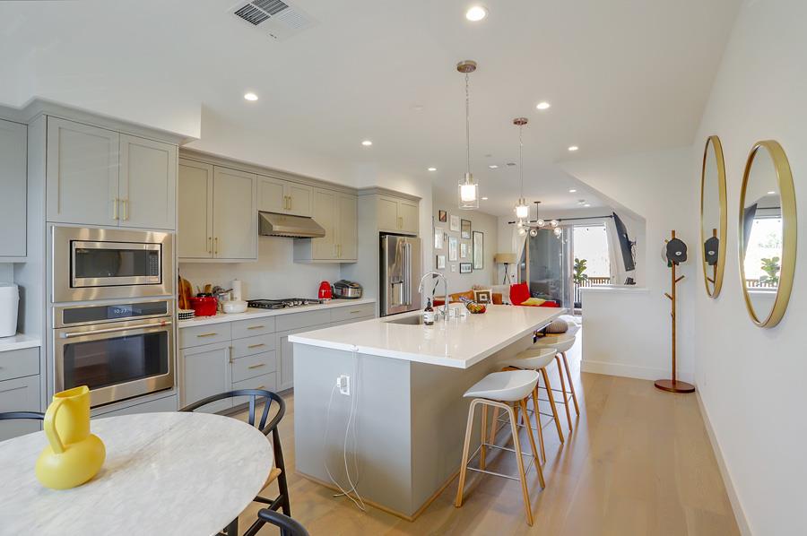 330 Marquetta Circle Mountain View, CA 94043 - Photo 7 of 26 a kitchen that has a lot of cabinets a island and appliances in it