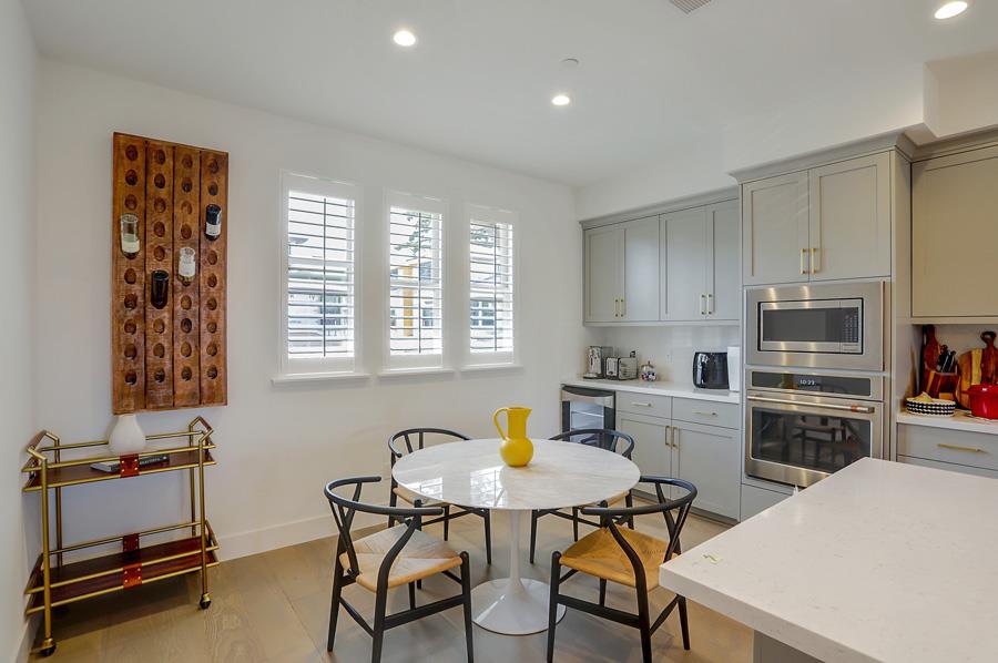 330 Marquetta Circle Mountain View, CA 94043 - Photo 9 of 26 a kitchen with a table chairs and a refrigerator