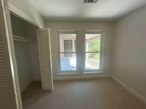 an empty room with windows