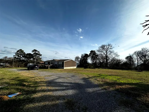 a view of outdoor space with deck and yard
