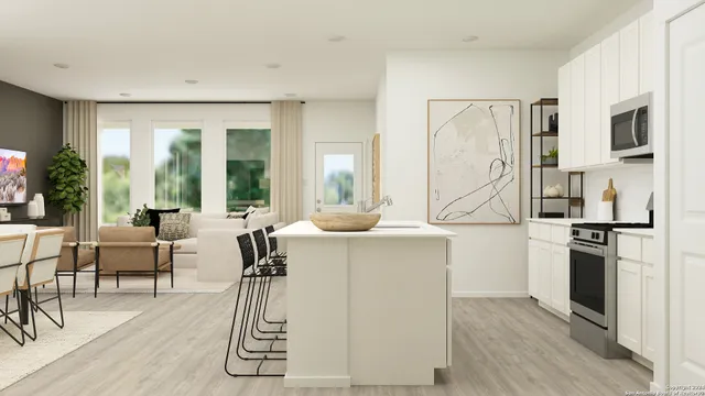 a very nice looking living room with a couch and a stove top oven