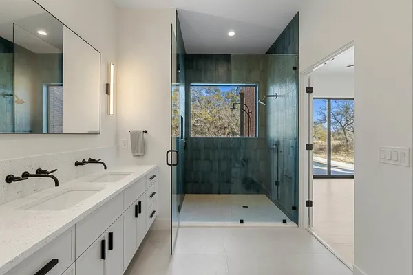 a bed room with a bed and a large window