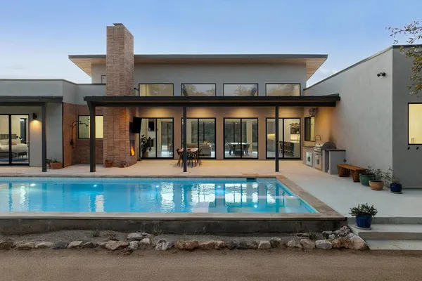 a view of a yard with an outdoor seating