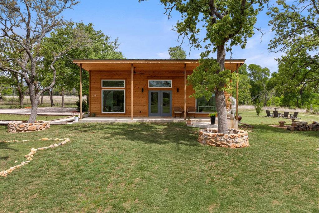 444 Klein Road Stonewall, TX 78671 - Photo 39 of 55 a front view of a house with a yard